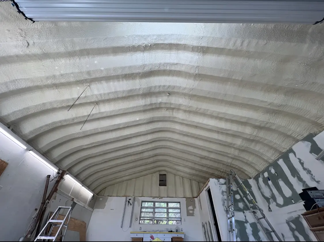 Spray polyurethane foam applied to the underside of a metal roof deck in Placerville